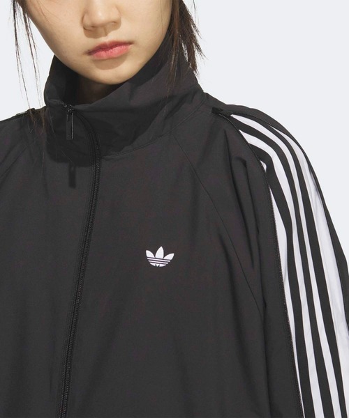 adidas(アディダス)の「スリーストライプス ジップ トラックトップ トラックジャケット(ジャージ) / アディダスオリジナルス adidas Originals(ナイロンジャケット・レディース・ブラック・X-LARGE/X-SMALL/LARGE/SMALL/MEDIUM/XX-LARGE)」の6枚目の写真