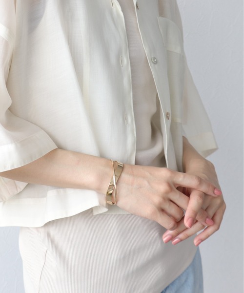 Three Four Time（ｽﾘｰﾌｫｰﾀｲﾑ）の「クロスバングル（バングル/リストバンド・レディース・シルバー/ブラウン/ゴールド・FREE）」の3枚目の写真