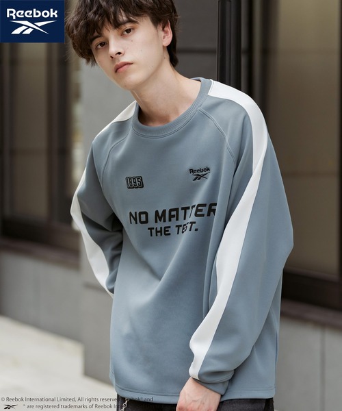 Rocky Monroe(ロッキーモンロー)の「Reebok リーボック オーバーサイズ袖ラインロゴ刺繍ラグランポンチ長袖ゲームシャツ(Tシャツ/カットソー・メンズ・ブルーグレー/ブラック/ホワイト・L/M)」の1枚目の写真