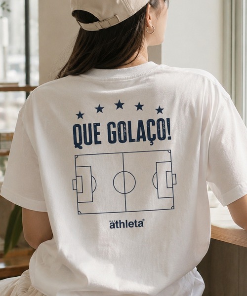 ATHLETA(アスレタ)の「【ZOZO限定・新柄追加】≪ATHLETA/アスレタ≫ブラジルのフットボールムードが映える大人のプリントTシャツ。ゆるっと体型カバーしながらレディースもメンズも着回せるサイズ対応(Tシャツ/カットソー・レディース・ブラック系1/オフホワイト/ブラック系2/ブラック系/ブラック/ホワイト系1/ホワイト系/ホワイト系2/ホワイト系3/ホワイト系4/ブラック系4/ブラック系3/ホワイト系5/ブラック系5/ブラック系6/ホワイト系6/ホワイト系7/ブラック系7/ホワイト系8/ブラック系8/ベージュ/ブルー/グリーン/イエロー系その他/ネイビー/ブラック系その他/ベージュ系その他/ブラック系その他2/イエロー/ホワイト系その他/スミクロ/チャコールグレー/ブルー系その他/ホワイト系その他2/マスタード/ネイビー系/グリーン系その他/イエロー系/ホワイト系9/ブラック系9・L/M/S)」の13枚目の写真