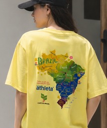 ATHLETA（アスレタ）の「【ZOZO限定・新柄追加】≪ATHLETA/アスレタ≫ブラジルのフットボールムードが映える大人のプリントTシャツ。ゆるっと体型カバーしながらレディースもメンズも着回せるサイズ対応（Tシャツ/カットソー）」