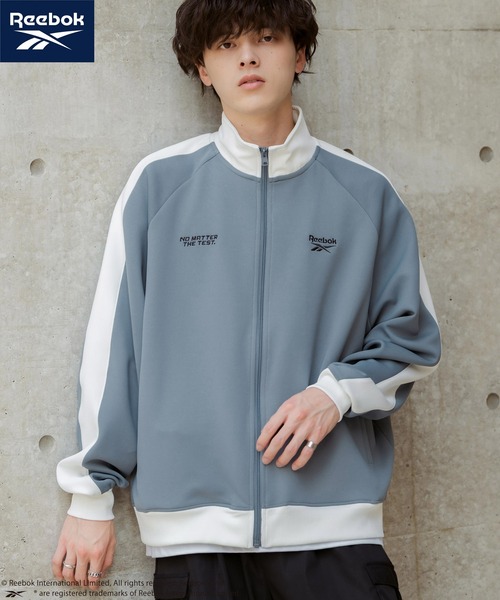 Rocky Monroe(ロッキーモンロー)の「Reebok リーボック オーバーサイズ袖ラインワンポイントロゴ刺繍ポンチトラックジャケット(ブルゾン・メンズ・ブラック/ホワイト/ブルーグレー・M/L)」の1枚目の写真
