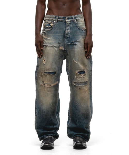 NUBIAN（ヌビアン）の「【PURPLE STAIN】SPRAY LOGO DENIM PANTS