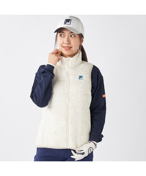 FILA GOLF(フィラゴルフ )の「FILA GOLF フィラゴルフ ゴルフウェア ワンポイント ロゴ 軽量 撥水 中綿入り フルジップ ハイネック ライトダウンベスト(ダウンベスト・レディース・オフホワイト/ブラック・LL/L/M)」の2枚目の写真