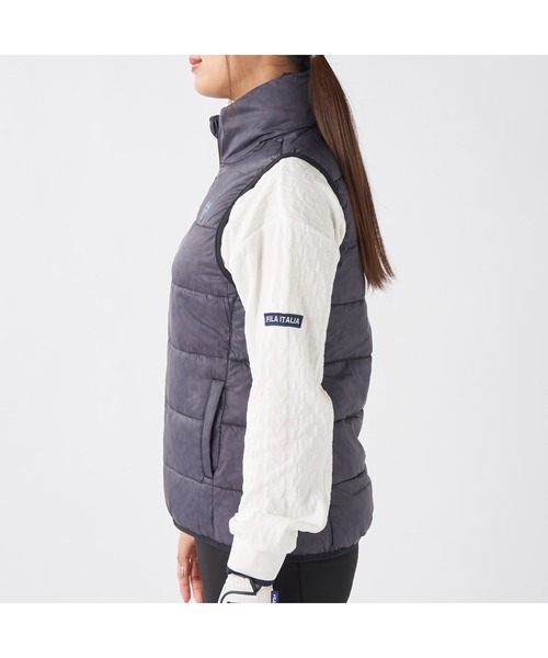 FILA GOLF(フィラゴルフ )の「FILA GOLF フィラゴルフ ゴルフウェア ワンポイント ロゴ 軽量 撥水 中綿入り フルジップ ハイネック ライトダウンベスト(ダウンベスト・レディース・オフホワイト/ブラック・LL/L/M)」の14枚目の写真