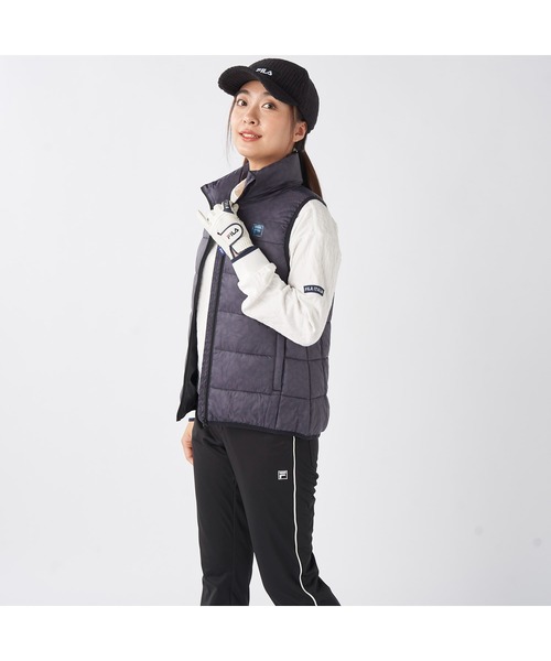 FILA GOLF(フィラゴルフ )の「FILA GOLF フィラゴルフ ゴルフウェア ワンポイント ロゴ 軽量 撥水 中綿入り フルジップ ハイネック ライトダウンベスト(ダウンベスト・レディース・オフホワイト/ブラック・LL/L/M)」の11枚目の写真