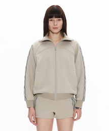 WELLBEING EXPRESS（ウェルビーイングエクスプレス）の「Embroidered Track Jacket Warm Grey（ナイロンジャケット）」