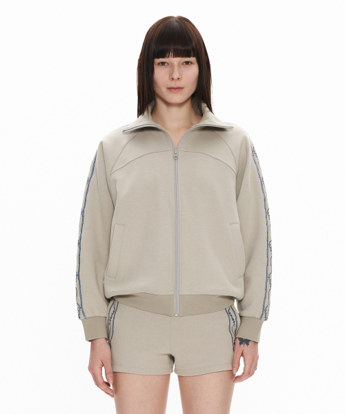 WELLBEING EXPRESS(ウェルビーイングエクスプレス)の「Embroidered Track Jacket Warm Grey(ナイロンジャケット・レディース・その他・SMALL/MEDIUM)」の1枚目の写真