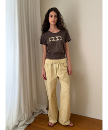 ECOMMAE（イコンマイ）の「PATCHWORK CURVED PANTS (YELLOW)（その他パンツ）」