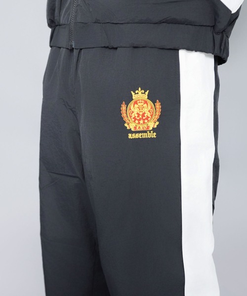 SPINNS（スピンズ）の「ナイロントラックパンツ/エンブレム刺繍ロゴ/配色切替/セットアップ対応（その他パンツ・メンズ・ホワイト/ブラック/ネイビー/グリーン/ワイン・ONESIZE）」の18枚目の写真