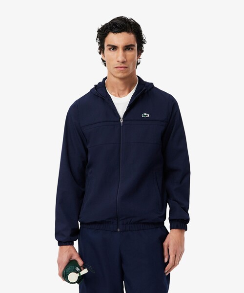 LACOSTE（ラコステ）の「『Lacoste x Netflix』 総柄ジップアップ