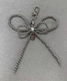 .KOM（ドットコム）の「『.KOM/ドットケーオーエム』リボンチャーム【Y】【CN】（キーホルダー）」