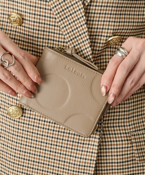 toleur（トーラ）の「【toleur】ランダムドット二つ折りウォレット