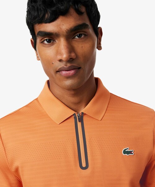 LACOSTE(ラコステ)の「UVカット ウルトラドライ コートジャカードジップポロシャツ(ポロシャツ・メンズ・オレンジ/ネイビー・4/5/3)」の7枚目の写真