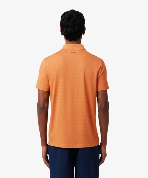 LACOSTE(ラコステ)の「UVカット ウルトラドライ コートジャカードジップポロシャツ(ポロシャツ・メンズ・オレンジ/ネイビー・4/5/3)」の8枚目の写真