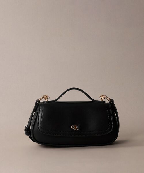 Calvin Klein(カルバン・クライン)の「クロスボディバッグ - トップハンドルクロスボディバッグ(ショルダーバッグ・レディース・ブラック/アイボリー/ピンク系その他・FREE)」の2枚目の写真