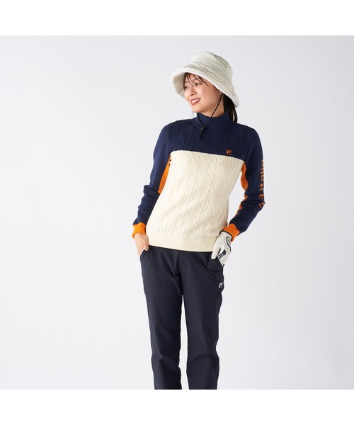 FILA GOLF(フィラゴルフ )の「FILA GOLF フィラゴルフ ゴルフウェア ワンポイント ロゴ 配色切替 ハイネック モックネックセーター(ニット/セーター・レディース・ネイビー/イエロー/ブラック・M/L/LL)」の12枚目の写真
