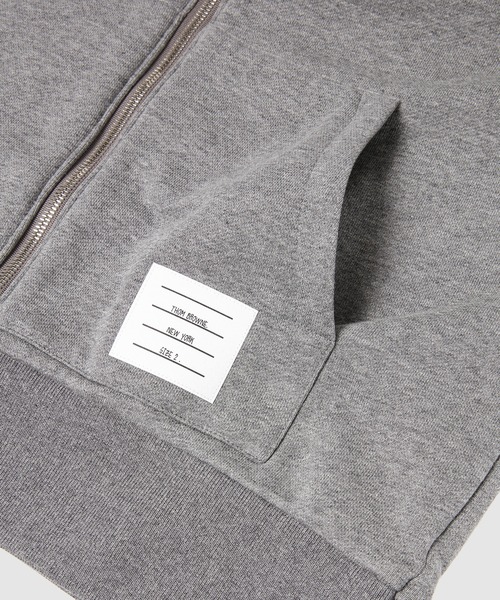 THOM BROWNE（トムブラウン）の「RELAXED FIT ZIP UP HOODIE W/ TONAL 4 BAR SLEEVE IN