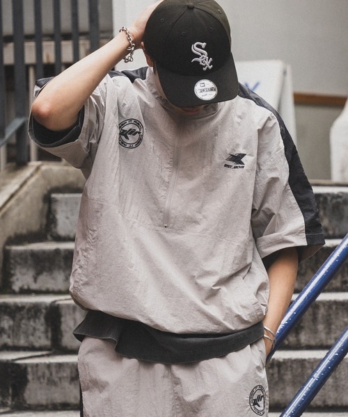 kutir（クティール）の「ナイロン半袖トラックハーフジップ