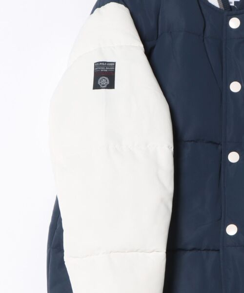 U.S. POLO ASSN.(ユーエスポロアッスン)の「【U.S. POLO ASSN. /ユーエスポロアッスン 】パデッドヴァーシティジャケット スタジャン(スタジャン・メンズ・カーキ/ネイビー・X-LARGE/LARGE/MEDIUM)」の4枚目の写真