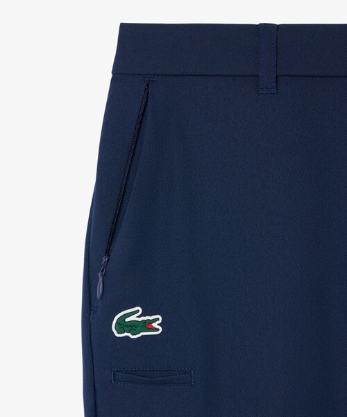 LACOSTE(ラコステ)の「UVカット 吸水速乾 ウルトラドライ スリムフィットストレッチゴルフパンツ(チノパンツ・レディース・ネイビー/ベージュ・38/36/34)」の16枚目の写真