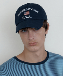 WEDNESDAY OASIS（ウェンズデーオアシス）の「フラッグダメージボールキャップ_NAVY(WB6AC07)（キャップ）」