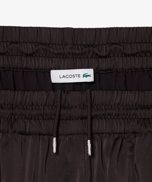 LACOSTE（ラコステ）の「オーバーサイズイージーサテンフレアパンツ（その他パンツ・レディース・ブラック・40/38/36/34）」の6枚目の写真