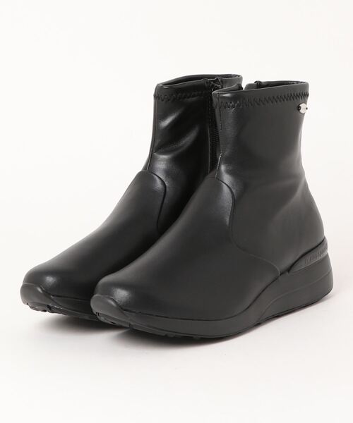 le coq sportif(ルコックスポルティフ)の「【レイン対応】ヒールアップショートブーツ(アンジェ II)(ブーツ・レディース・クリーム/ブラック系その他6/ブラック/ブラック系その他3/ブラウン・LL/L/M)」の2枚目の写真