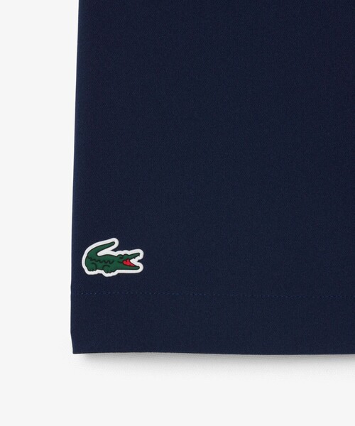 LACOSTE(ラコステ)の「吸汗速乾 ウルトラドライ フラップデザインストレッチテニスショーツ / ミニスカート(スカート・レディース・ネイビー/ホワイト・36/38/34)」の8枚目の写真