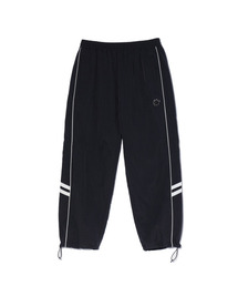 ACEI（アセイ）の「Wappen decorated piping color blocking track pants (UNI) black（スウェットパンツ）」