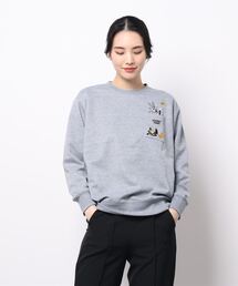 ACCOMMODE | ルーニー・テューンズ /ポンチクルートレーナーポケツキ（ウィメンズ）(スウェット)