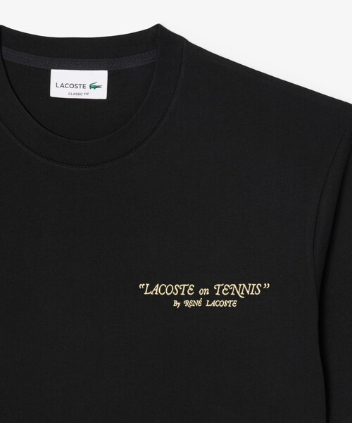 LACOSTE(ラコステ)の「ルネ・ラコステ シグネチャー刺繍ロゴ&ラケットバックプリント半袖Tシャツ(Tシャツ/カットソー・メンズ・ホワイト/ブラック・5/4/2/3)」の1枚目の写真