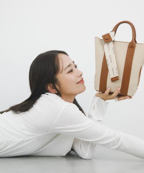 RODE SKO(ロデスコ)の「『別注』AJUGA.×RODE SKO ロゴリボン付ショルダーバッグ(ショルダーバッグ・レディース・オフホワイト/アイボリー/イエロー/ベージュ・ONE)」の1枚目の写真