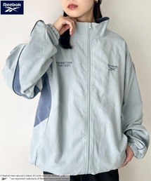 Reebok（リーボック）の「Reebok(リーボック)/パイピングJKT/ライン入り ナイロンジャケット トラックジャケット（ブルゾン）」