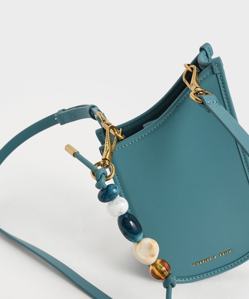 CHARLES & KEITH(チャールズ & キース)の「ビーズエンベリッシュド ストラップフォンポーチ / Bead-Embellished Strap Phone Pouch(ボディバッグ/ウエストポーチ・レディース・ブラウン系その他4/ブルーグリーン/オレンジ系その他2・XS)」の16枚目の写真