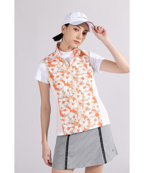New Balance Golf(ニューバランスゴルフ)の「【new balance golf】【直営店舗限定】ハイビスカス総柄 フルジップ ベスト (WOMENS)(ベスト・レディース・ベージュ/ブラック・SMALL/MEDIUM)」の1枚目の写真