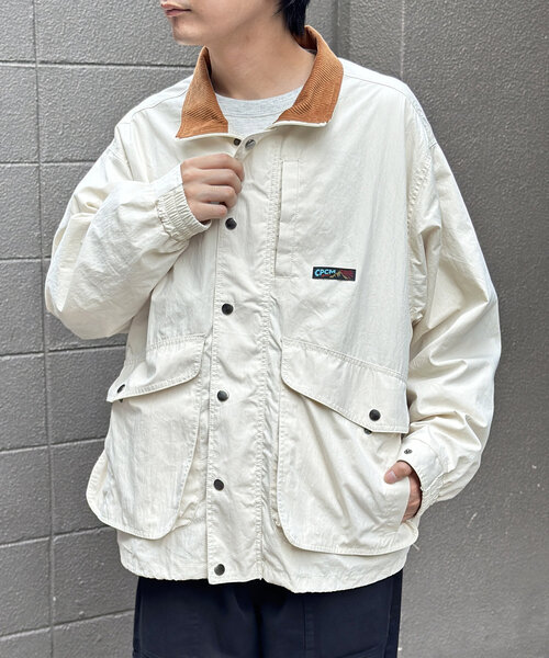 CPCM（シーピーシーエム）の「NCスタンドネックデカポケブルゾン（ブルゾン・メンズ・オレンジ/ブラック/アイボリー・MEDIUM/LARGE）」の2枚目の写真