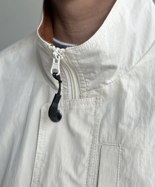 CPCM（シーピーシーエム）の「NCスタンドネックデカポケブルゾン（ブルゾン・メンズ・オレンジ/ブラック/アイボリー・MEDIUM/LARGE）」の9枚目の写真