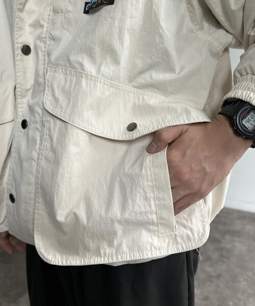 CPCM（シーピーシーエム）の「NCスタンドネックデカポケブルゾン（ブルゾン・メンズ・オレンジ/ブラック/アイボリー・MEDIUM/LARGE）」の13枚目の写真