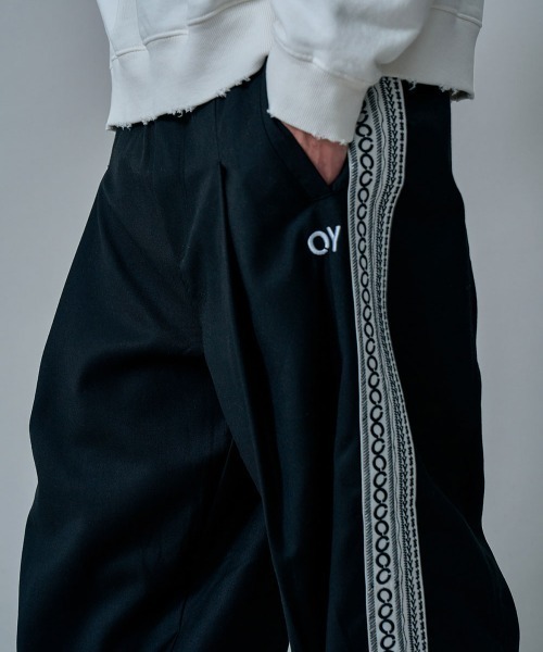 OY(オーワイ)の「『OY/オーワイ』ETHNIC TAPE PANTS/エスニック テープ サイドライン パンツ(カーゴパンツ・メンズ・ブラック/ブラウン・FREE)」の3枚目の写真