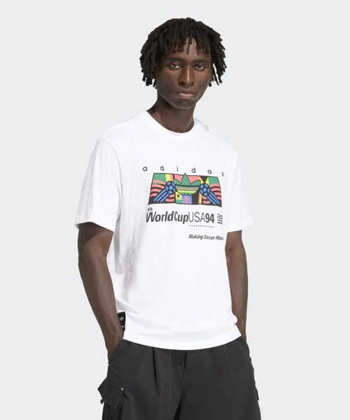 adidas(アディダス)の「アーカイブ アフリカ 94 グラフィック 半袖Tシャツ / アディダスオリジナルス adidas Originals(Tシャツ/カットソー・メンズ・ホワイト・SMALL/MEDIUM/LARGE/X-LARGE/XX-LARGE/X-SMALL/3XL)」の1枚目の写真