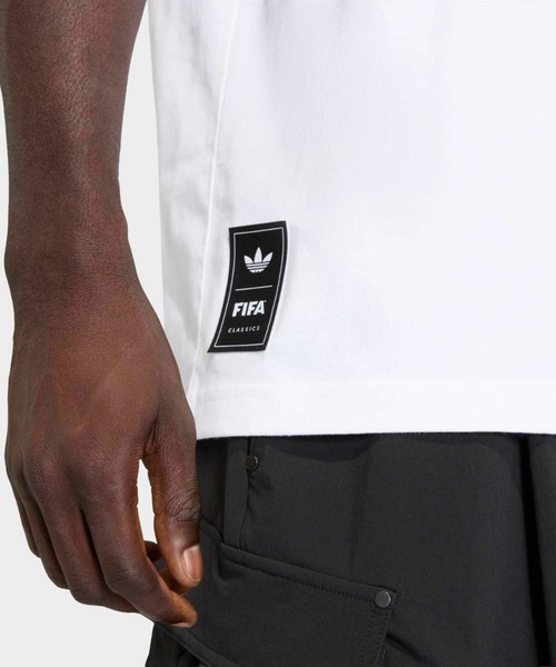 adidas(アディダス)の「アーカイブ アフリカ 94 グラフィック 半袖Tシャツ / アディダスオリジナルス adidas Originals(Tシャツ/カットソー・メンズ・ホワイト・SMALL/MEDIUM/LARGE/X-LARGE/XX-LARGE/X-SMALL/3XL)」の6枚目の写真