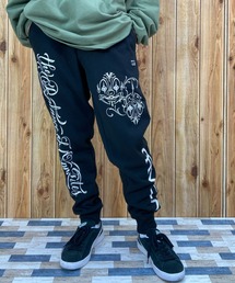 RVCA（ルーカ）の「RVCA/ルーカ×Mr.Cartoonコラボモデル ヘビーウェイト ジョガーパンツ/裏起毛 スウェットパンツ/ロゴプリント/セットアップ対応 BC042-726（スウェットパンツ）」