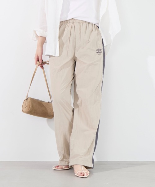 UMBRO(アンブロ)の「【UMBRO×MICA&DEAL】配色ナイロントラックパンツ(その他パンツ・レディース・ブラック/ベージュ・36)」の1枚目の写真