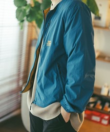 gym master（ジムマスター）の「ＲＶナイロンウインドブレイクノーカラーＪＫＴ（ノーカラージャケット・メンズ・ブルー系）」