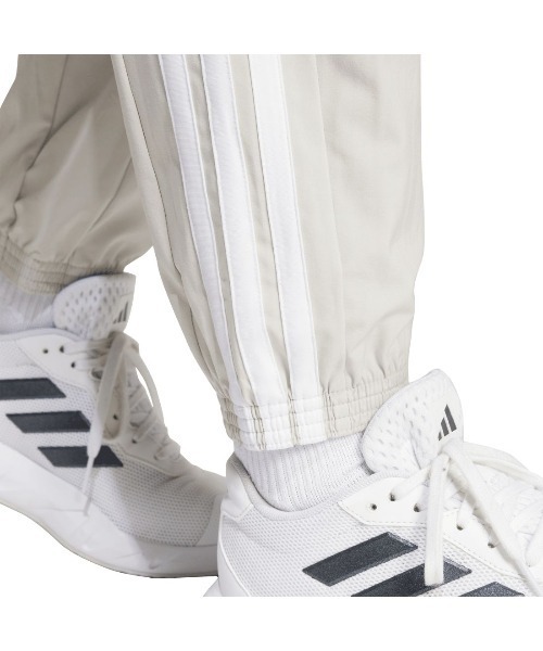 adidas(アディダス)の「アディダス adidas トレイン エッセンシャルズ スリーストライプス ウーブンパンツ(その他パンツ・レディース・ブラック/ライトグレー・M/L/S)」の9枚目の写真
