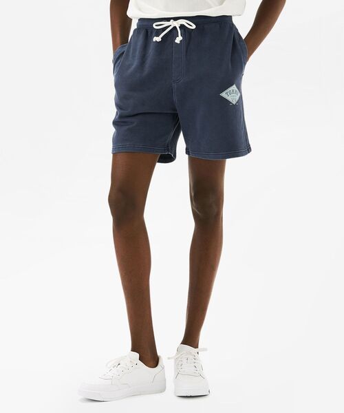 tommy jeans(トミー ジーンズ)の「レギュラーバーシティグラフィックショートパンツ(その他パンツ・メンズ・ネイビー/ベージュ/ピンク・LARGE/SMALL/MEDIUM/X-LARGE)」の1枚目の写真