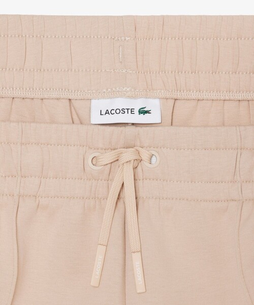 LACOSTE（ラコステ）の「ワイドレッグ スムーススウェットトラックパンツ / プリーツワイドパンツ（スウェットパンツ・レディース・ホワイト/ベージュ・40/38/34/36）」の8枚目の写真