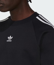 adidas（アディダス）の「アディダス Rekive クルーネック