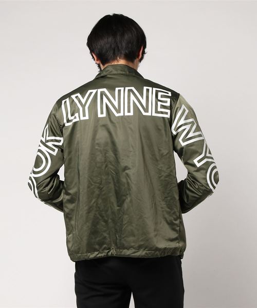 VENCEEXCHANGE(ヴァンスエクスチェンジ)の「ポリメモリービッグロゴコーチジャケット(ブルゾン・メンズ・オリーブ/ブラック・MEDIUM/LARGE)」の5枚目の写真
